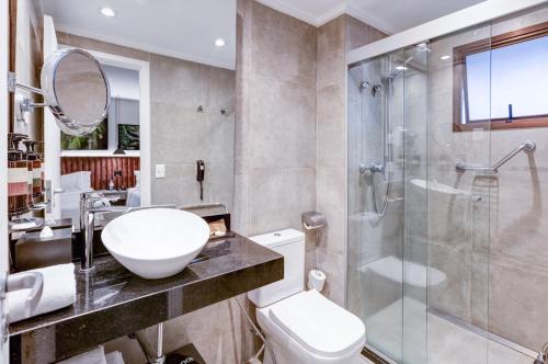 a bathroom with a sink toilet and a shower at Double Tree by Hilton São Paulo Itaim in Sao Paulo