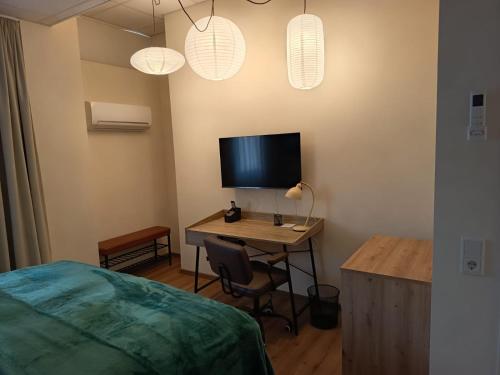 Μια τηλεόραση ή/και κέντρο ψυχαγωγίας στο Renatus Apartments