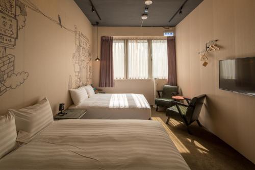 Postel nebo postele na pokoji v ubytování Cho Hotel