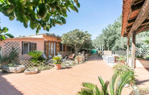a house with a brick walkway in a yard at Pet Friendly Home In Ragusa With Wifi in Ragusa