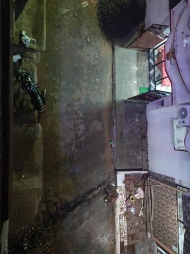 an dirty room with a dirty floor and a stove at Maa janki paying guest house in Ayodhya