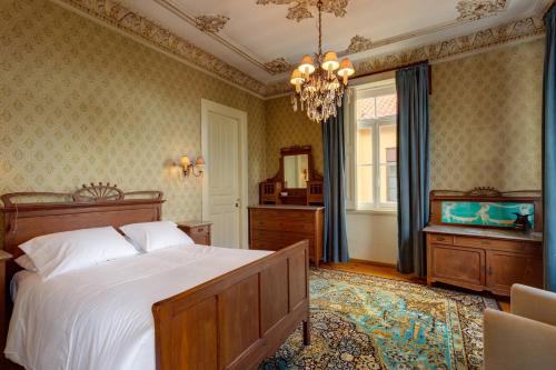 a bedroom with a bed and a television in it at Foz Townhouse- Sea, Garden & Garage in Porto