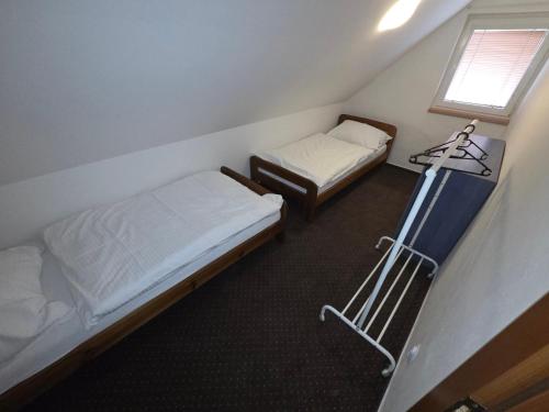 Postel nebo postele na pokoji v ubytování Apartmány Orlová