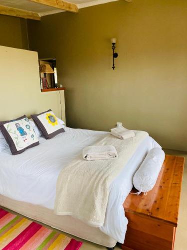 Postel nebo postele na pokoji v ubytování Imla Guest Farm