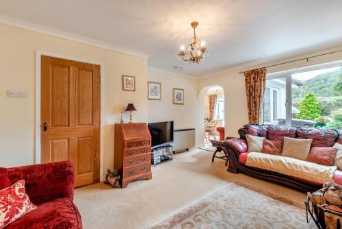 a living room with a couch and a tv at 2 Bed in Pooley Bridge oc-c33318 in Pooley Bridge