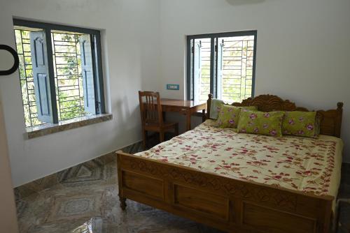 Ένα ή περισσότερα κρεβάτια σε δωμάτιο στο Muktadhara Eco Homestay