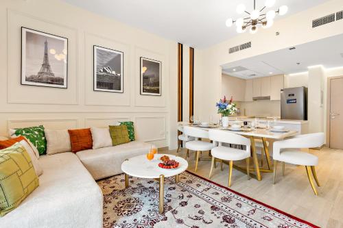 a living room with a couch and a table at Desert Key - Perfectly Located Yas Island Premier Apts in Abu Dhabi