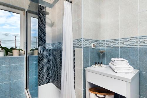 a bathroom with a shower and a sink at Apartment Studio Lara in Rovinj