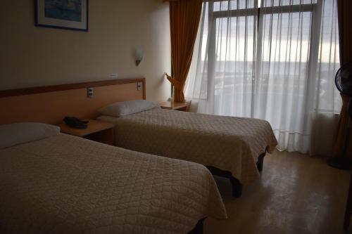 Ένα ή περισσότερα κρεβάτια σε δωμάτιο στο Hotel Arenas Blancas