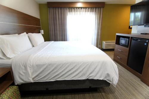 a hotel room with a large bed and a window at Holiday Inn Express - Santa Rosa North by IHG in Santa Rosa