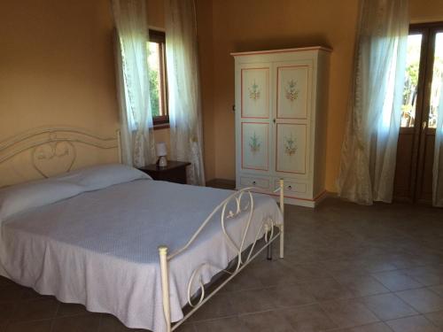 Giường trong phòng chung tại Il Melograno