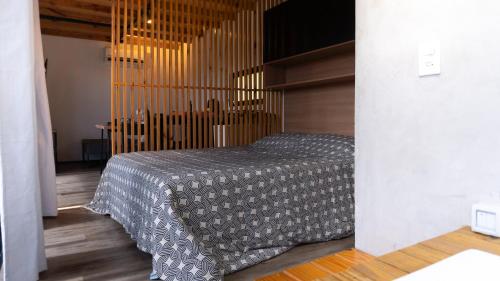 a bedroom with a bed in a room at Cabana Romântica em Pelotas in Pelotas
