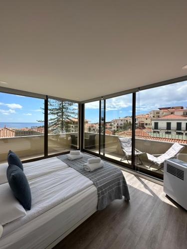 Postel nebo postele na pokoji v ubytování Valhalla Madeira Apartements