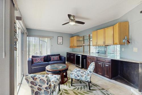 a kitchen with a couch and a table with chairs at Coastal Bliss in Juno Beach