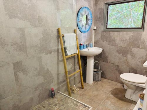 a bathroom with a sink and a toilet at 2 Bedroom Cottage - Sleeps 6 - Pool - Garden in Caylus