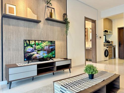 a living room with a flat screen tv on a wall at Starview Bay 3pax Forest City in Gelang Patah