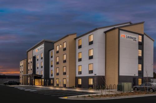a rendering of a hotel in a parking lot at LivAway Suites Tri-Cities-Richland in Richland