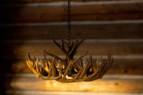 a chandelier with antlers hanging from a ceiling at Adams Rest cabin in The Dalles