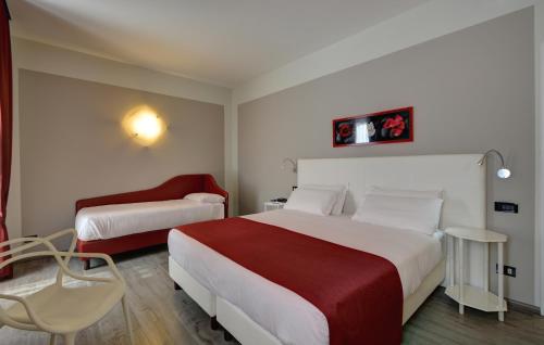 Postel nebo postele na pokoji v ubytování Best Western Hotel Genio