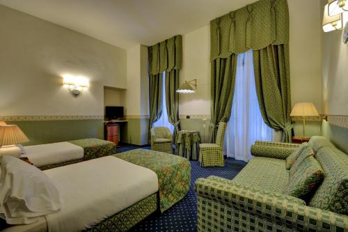 Postel nebo postele na pokoji v ubytování Best Western Hotel Genio