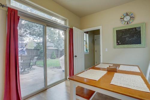 a room with a desk and a window with a table at Aspen Ridge in Bend