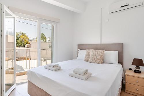 Ένα ή περισσότερα κρεβάτια σε δωμάτιο στο The Central Flat Limassol