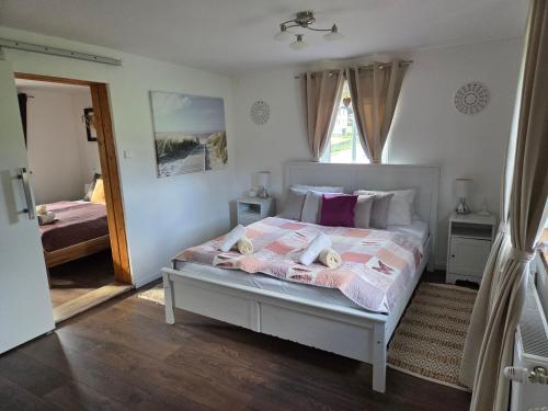 Postel nebo postele na pokoji v ubytování Alexandra Appartement