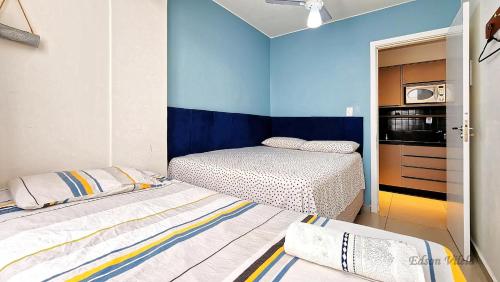 En eller flere senge i et værelse på Moderno 60m Roda gigante BrisaMarBC2