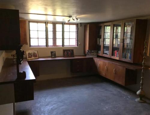 a large room with a counter in a room with windows at Villa Samithru, Wadduwa in Wadduwa