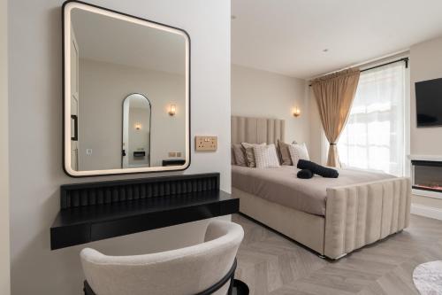 a bedroom with a bed and a large mirror at Entire Aparthotel Bold St 8 Apartments in Liverpool