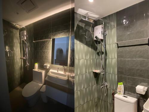 a bathroom with a sink and a toilet and a mirror at Modern and Cozy 3BR Staycation Home in Tarlac