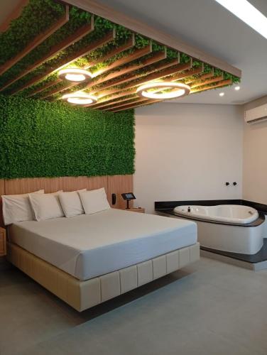 Ένα ή περισσότερα κρεβάτια σε δωμάτιο στο STILLUS - Hotel e Motel