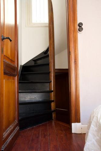 a staircase in a room with a mirror at Villa Paul in Blankenberge