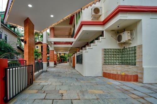 an empty hallway of a building with stairs on it at Hotel Dimaru Boutique in Calangute