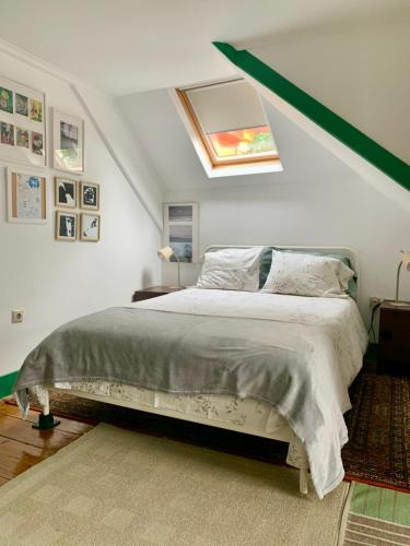 a bedroom with a bed with a green roof at Casa do Paço Aveiro - Studio&Rooms in Aveiro