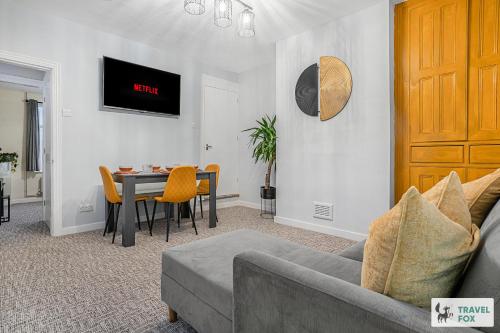 a living room with a couch and a table at Sophie's House in Nottingham