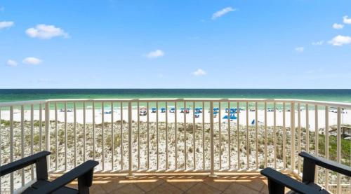 a view of a beach with chairs and umbrellas at Sans Souci Unit 204 in Villa Sabine