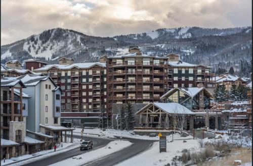a hotel in the mountains with snow on the ground at Condos at Canyons Resort by White Pines in Park City