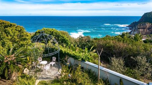 a view of the ocean from a bluff at Knysna Pearl View Guest House in Knysna