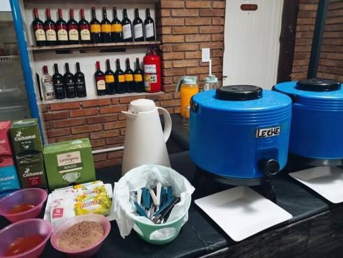 a counter with a table with some food and drinks at Hotel posada sol in Villa Carlos Paz