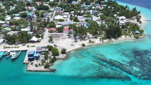 an aerial view of an island in the ocean at Feeali Buddies Inn 