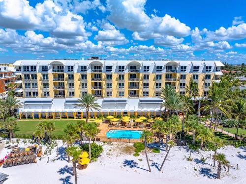 an aerial view of a resort with a pool and palm trees at Beach Residences On Siesta, aka The Hyatt in Siesta Key