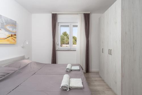 Ένα ή περισσότερα κρεβάτια σε δωμάτιο στο Apartment Juli