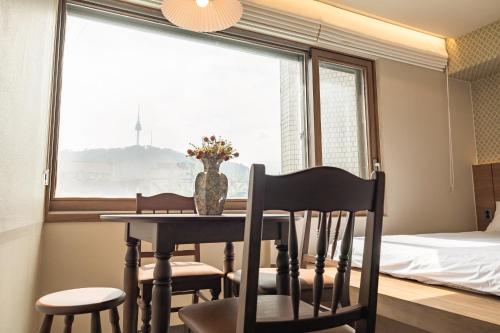 Un ou plusieurs lits dans un hébergement de l'établissement EXTAY Mansion Chungmuro