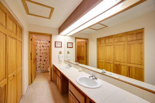 a bathroom with two sinks and a large mirror at 1 Mi to Main Street Mtn-View Home in Frisco in Frisco