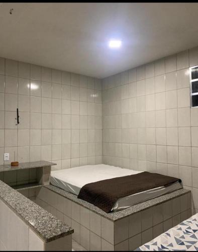 Ένα ή περισσότερα κρεβάτια σε δωμάτιο στο Pousada Lagoa Azul - Ponta da Fruta