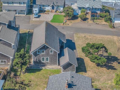 an aerial view of a house in a neighborhood at The Tides Inn in Lincoln City