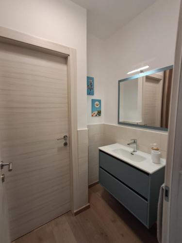 a bathroom with a sink and a mirror at Interno 10 in Capolona