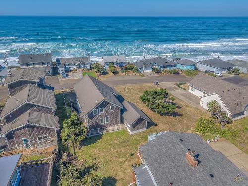 an aerial view of a house near the ocean at The Tides Inn in Lincoln City