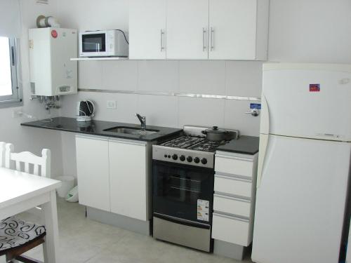 Una cocina o kitchenette en Temporario 44